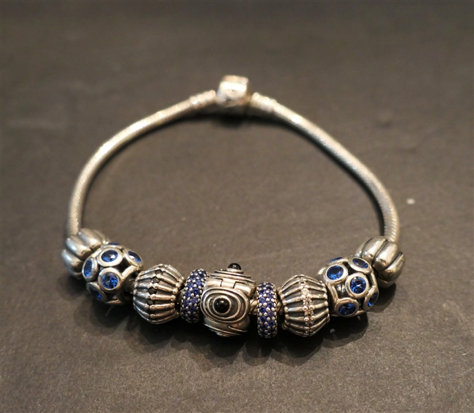 Sterling Silver Pandora Bracelet - 9 Beads -4 With Bright Blue Stones, 1 with Black Onyx - Bracelet Measures 8"