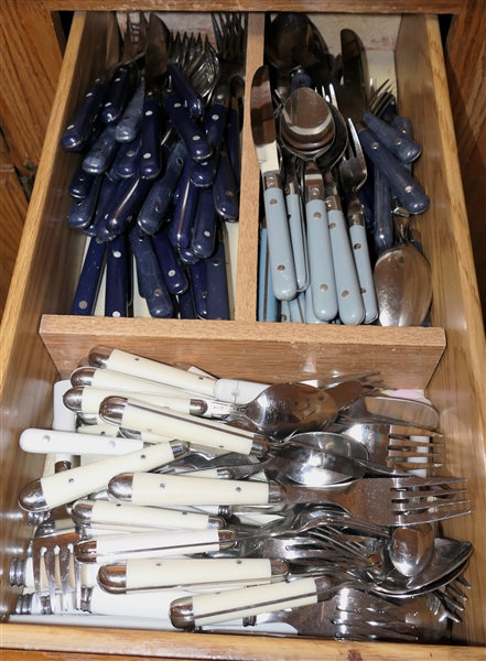 Drawer Full of Flatware - White Handled, Navy Blue Handled, and Light Blue Handled - Makers include Guy Degrenne - Inox France, Mardi Gras Stainless, Pfaltzgraff,