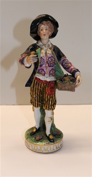 Highly Detailed Antique Porcelain Gentleman Figure - Man with Hat and Basket of Fruits - Figure Measures 8 1/2" Tall - Hat Has Small Chip Some Paint Flaking on Pants