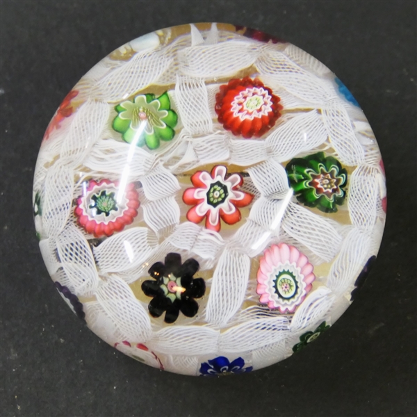 Millefiori Art Glass Paperweight the Red and Green  Millefiori Flowers - White Ribbon Threading - Measures 1 1/2" Tall 2" Across