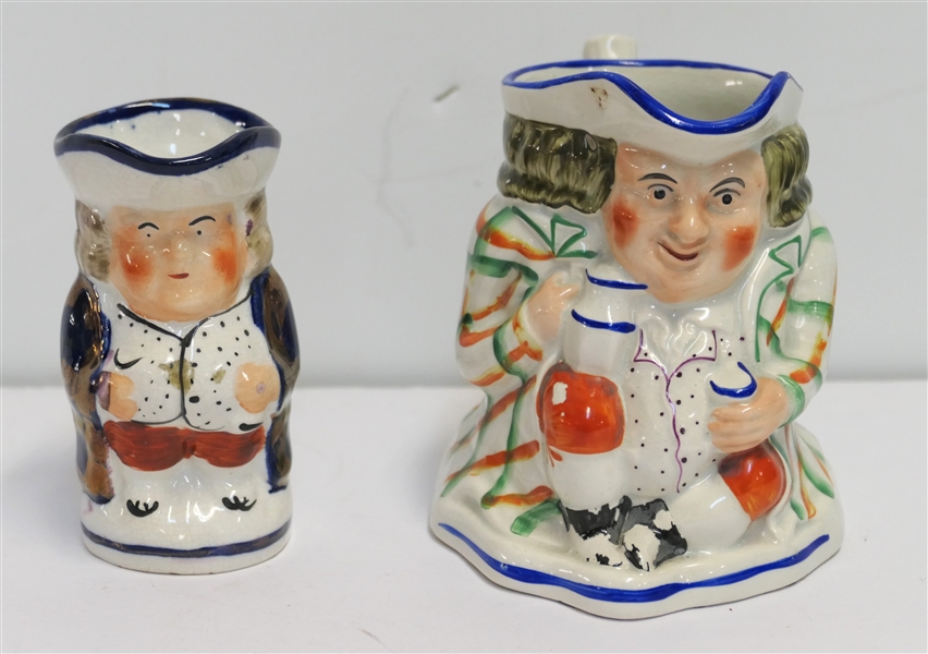 2 Antique Staffordshire Toby Jugs  - Smaller 4" with Copper Lustre Accents and 4 1/2" with Some Glaze Missing on Knee and Feet 