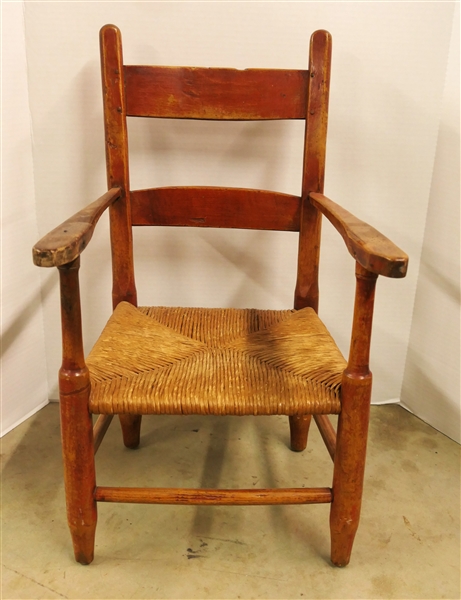 Red Painted Childs Pegged Ladderback Arm Chair Rush Bottom - Chair Measures 24" tall 13" by 11" 