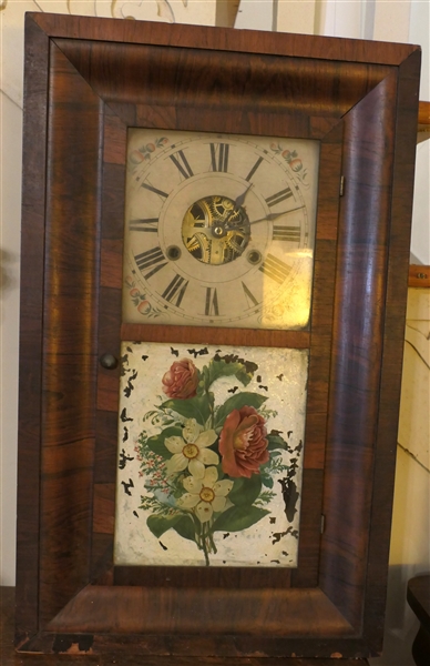 Seth Thomas Weight Driven Clock in Ogee Case - Reverse Painted Flowers on Door -Case Measures 25 1/2" Tall 15" by 5" - Some Veneer Missing - Original Paper Label Inside - Clock Runs