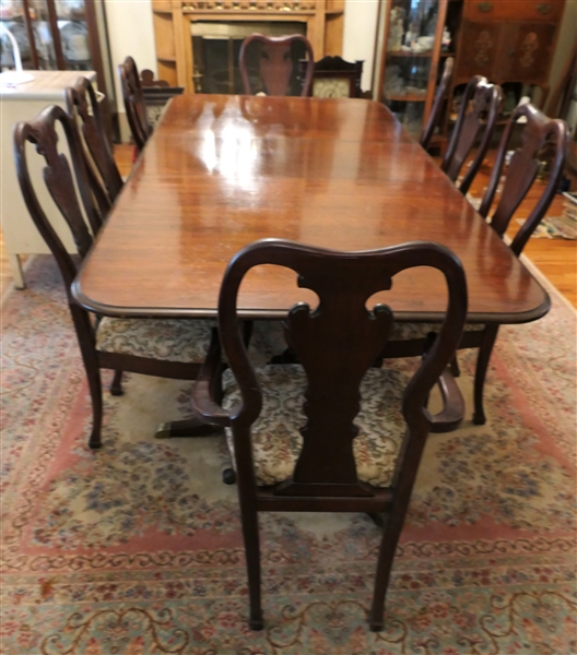 Double Pedestal Dining Table with 8 Chairs - Mahogany Finish - 6 Side Chairs and 2 Captains - Table Has 2 Leaves (1 Inserted) - Each Leaf measures 20" - As Pictured Table Measures 92" by 44" - One...