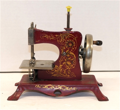 Casige Made in Germany Red Metal Antique Childs Sewing Machine - Hand Crank - Good Paint with Gold Scroll Paint - Marked with an Eagle - Made in Germany -  Machine Measures 7 1/2" Tall 