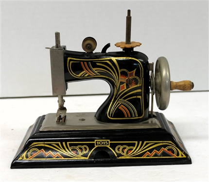 Germany Made Childs Art Deco - Metal Sewing Machine - Number 1015  - Excellent Graphics - Hand Crank Driven - Machine Measures 7" tall 