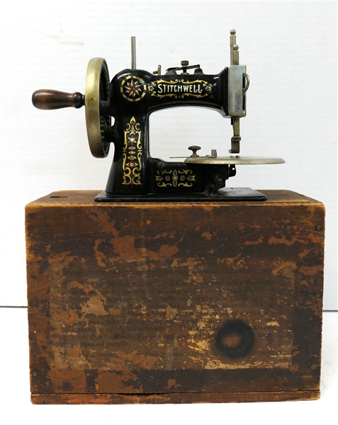 "Stitchwell"  Childs Miniature Sewing Machine - Crank Driven - Enamel Painted Cast Iron - in Wooden Sewing Machine Box - Machine Measures 5" Tall 