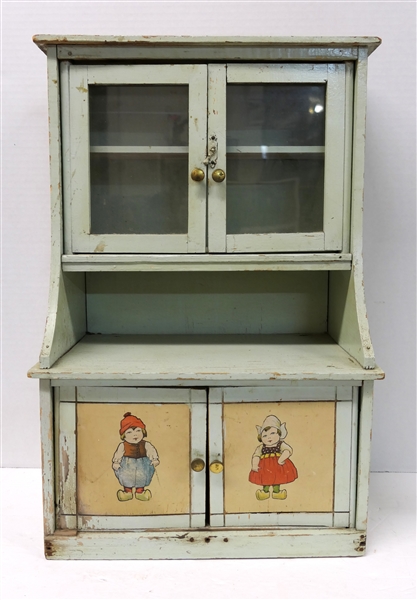 Childs Green Painted Miniature Kitchen Cabinet With Dutch Boy and Girl -  Measures 19" Tall 