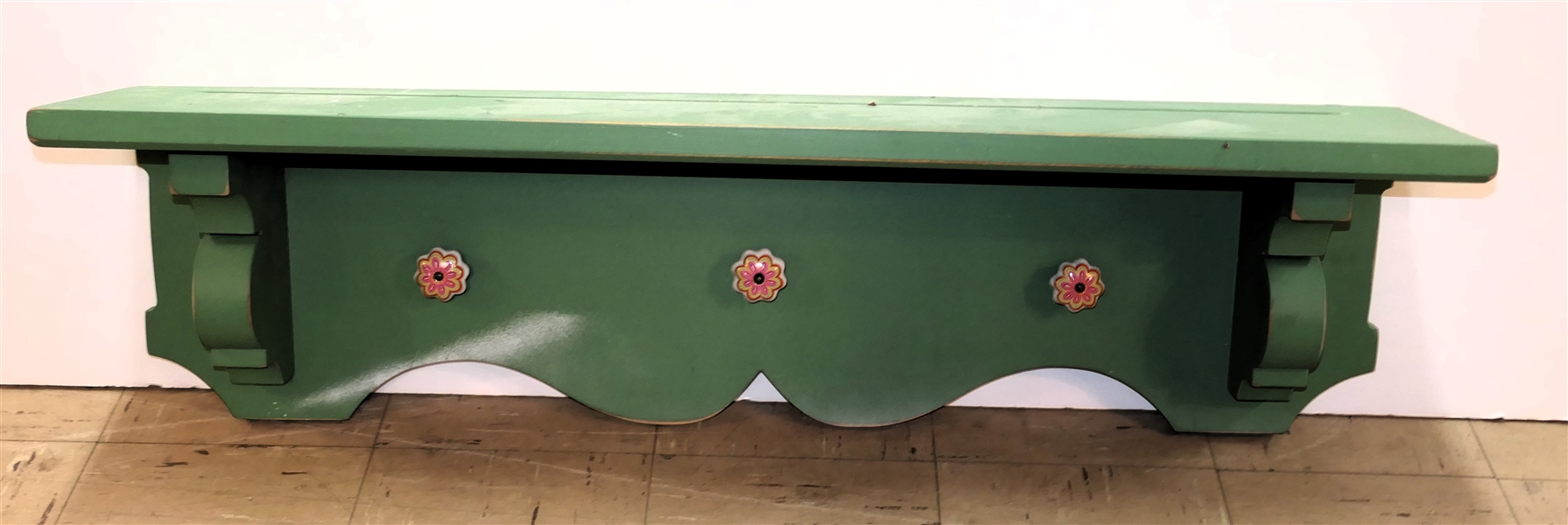 Green Painted Hanging Wall Shelf with 3 Floral Porcelain Knobs - Plate Groove on Top - Scalloped Edge At Bottom - Shelf Measures 40" Long