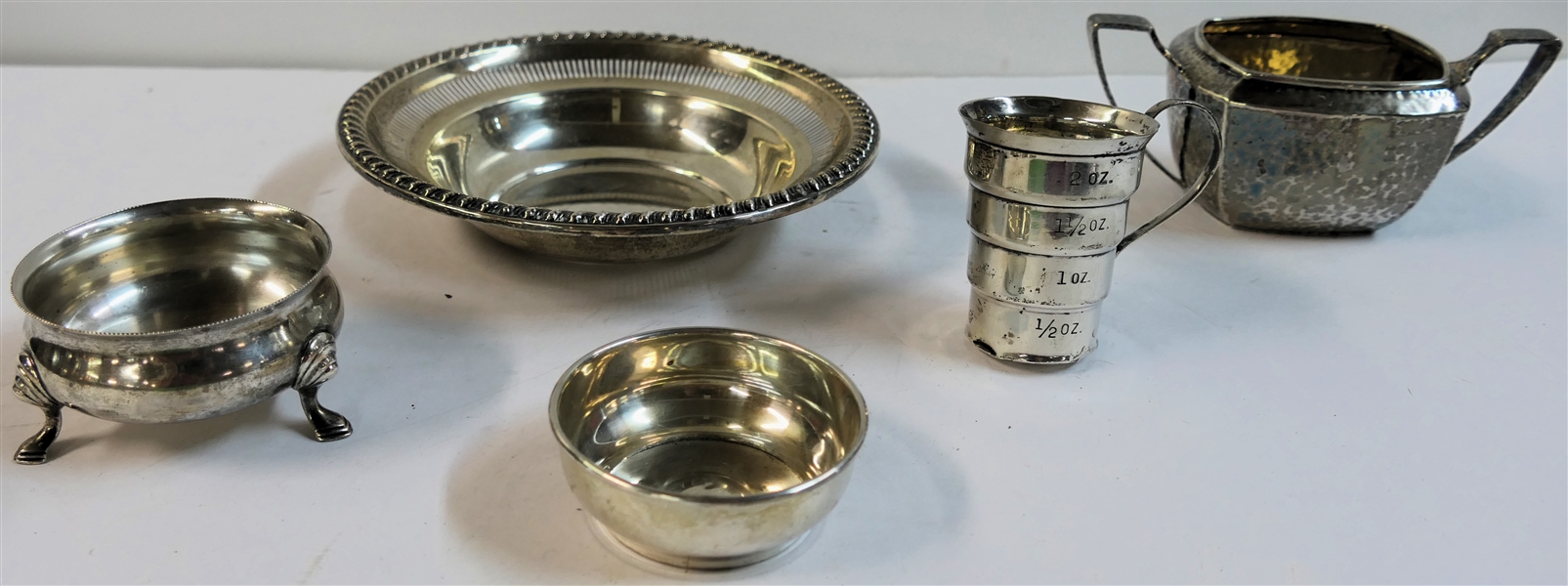 5 Pieces of Sterling Silver including Rogers Sterling Bowl, Hammered Sugar Dish, Bigelow Kennard & Co. Master Salt, Napier Sterling Jigger, and Small Bowl - Jigger is Dented - 351 Grams Total Weight 