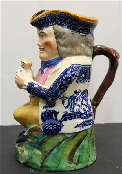 Larger Early Nineteenth Century Toby Jug - Blue Willow Transferware Details Around Hat and On Jacket - Has Been Repaired with Copper Bands / Staples - Jug Measures 9 1/4" Tall 