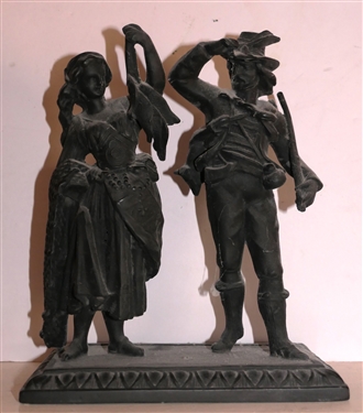 Iron Man and Woman Statue - Woman Holding String of Fish - Gentleman with Gun - Figure Measures 8 1/2 Tall 7 Across - Lady's Arm Is Cracked - See Photo - Can Be Used On Top of Previous Clock 