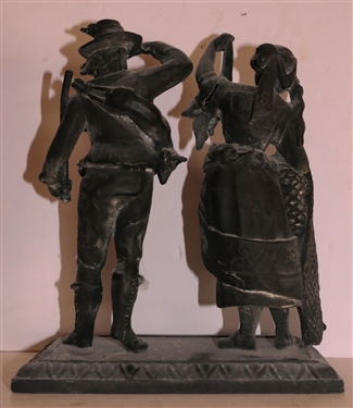 Iron Man and Woman Statue - Woman Holding String of Fish - Gentleman with Gun - Figure Measures 8 1/2 Tall 7 Across - Lady's Arm Is Cracked - See Photo - Can Be Used On Top of Previous Clock 