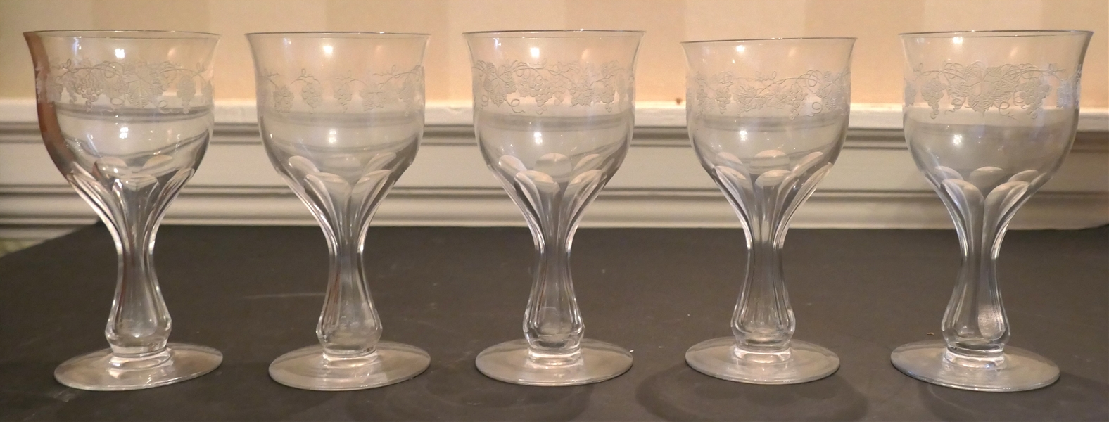 5 Hollow Stem Wine Glasses with Etched Grapes - Paneled Stems - Each Glass Measures 5 1/4" tall 