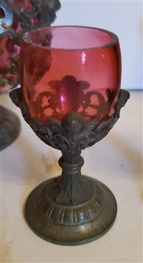 Outstanding Cranberry Glass Decanter and Cordial Set - Framed with Scrollwork and Cherubs - 1 Decanter with Handle and 1 Without - Decanter Measures 9 Tall 