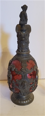 Outstanding Cranberry Glass Decanter and Cordial Set - Framed with Scrollwork and Cherubs - 1 Decanter with Handle and 1 Without - Decanter Measures 9 Tall 