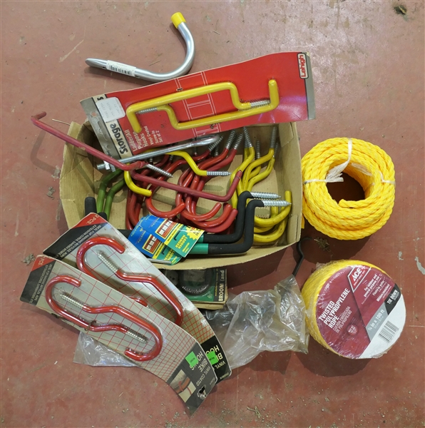 Garage Lot including Yellow Rope and Assorted Sizes of Hooks and Hangers