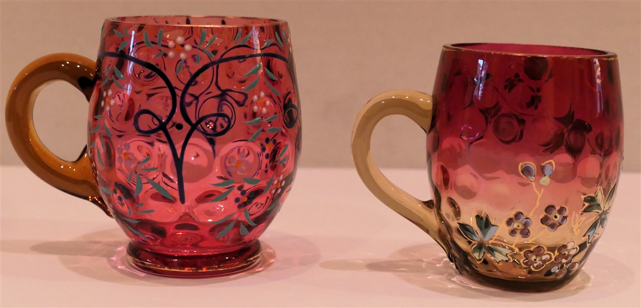 2 Cranberry Glass Mugs with Enamel Painted Flowers - Larger Coin Dot Measures 3 1/4" Tall 