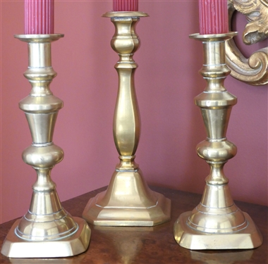 Pair of 9 Brass Push Up Candle Sticks and Single 10 Candle Stick 