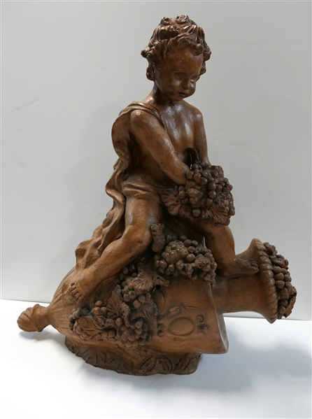 Terracotta Cherub Garden Statue  - Cherub on Urn with Grapes and Leaves - Statue Measures 29" tall 28" Long 12" Across - 2 Minor Broken Leaves 