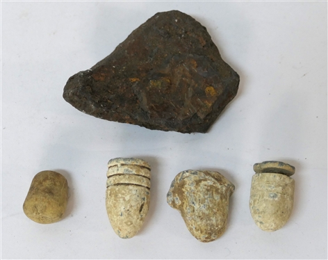3 Civil War Bullets and Civil War Cannonball Fragment in Fluted Tin Tart Pan - Also with Extraneous Rubber Fragment - Cannonball Piece Measures 2 1/4 by 1 5/8 - Tin Measures 3 1/2