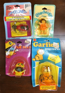 4 New Old Stock Vintage Toys in Original Blister Packs - 1982 Garfield,1984 Cabbage Patch Kids, 1982 Mrs. Pac Man, and 3 Wheelin'' Coin Cycle 