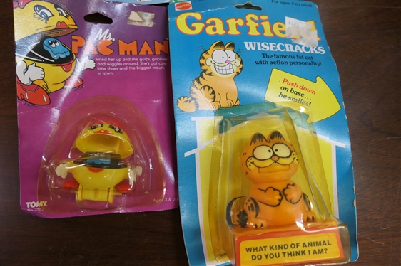 4 New Old Stock Vintage Toys in Original Blister Packs - 1982 Garfield,1984 Cabbage Patch Kids, 1982 Mrs. Pac Man, and 3 Wheelin'' Coin Cycle 