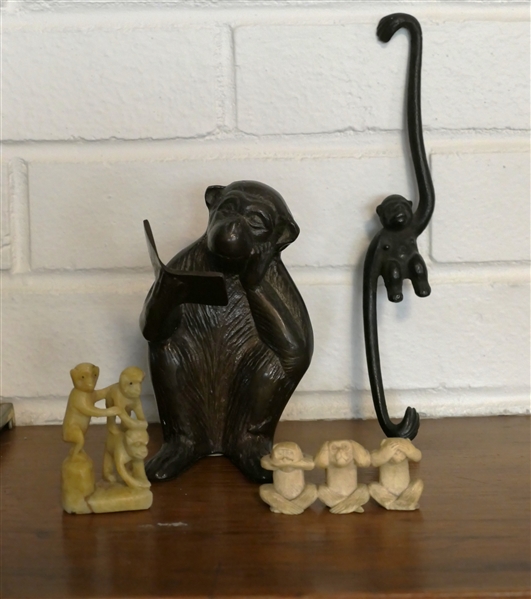 Collection of Monkeys - Bronze Reading a Book, Iron Hanging Monkey, and 2 Sets of Carved Monkeys - Bronze Reading Monkey Measures 5 1/4" Tall