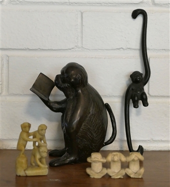 Collection of Monkeys - Bronze Reading a Book, Iron Hanging Monkey, and 2 Sets of Carved Monkeys - Bronze Reading Monkey Measures 5 1/4 Tall