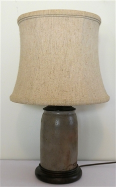Virginia Gray Stoneware Storage Jar Converted Into Table Lamp - Wood Base - Jar Has Been Drilled for Lamp Cord - Lamp Has Brass Bird Finial - Measures 12 To Bulb 