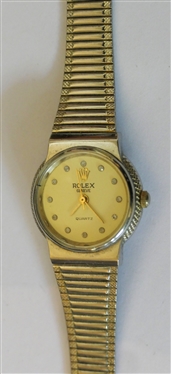 Rolex of Geneva Swiss Made Quartz Rolex Ladies Wrist Watch - Swiss Quartz Number 17  85030051 97 - Stainless Steel Rolex Band - Diamond Number Markers on Dial - Measures 1 Across Dial 
