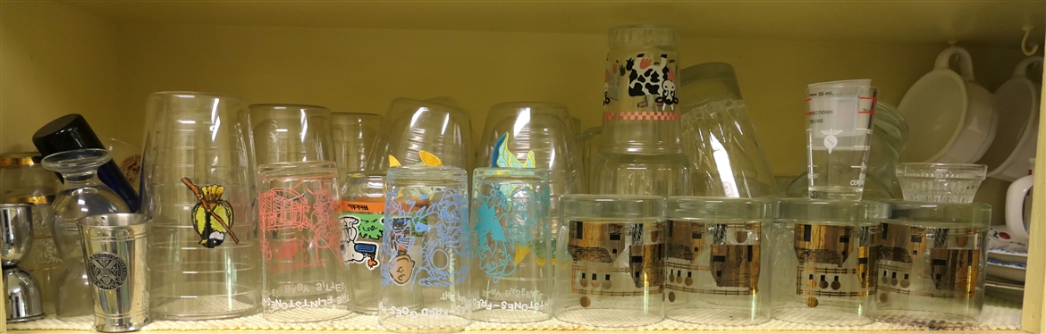 Shelf Lot of Glasses - Flintstones, Tervis Tumblers, Couroc Mid Century, Clear Tumblers, and Assorted Shot Glasses