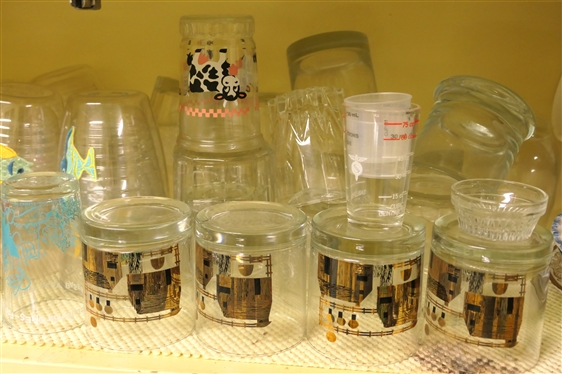 Shelf Lot of Glasses - Flintstones, Tervis Tumblers, Couroc Mid Century, Clear Tumblers, and Assorted Shot Glasses