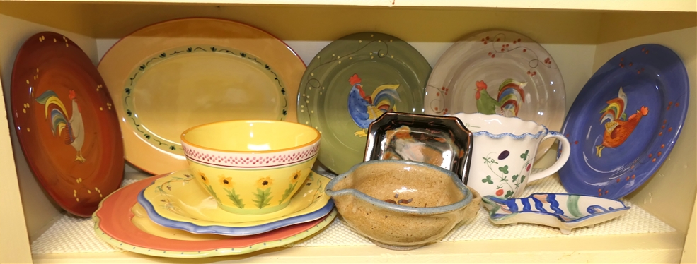 Kitchen Shelf Lot including Pfaltzgraff Pistoulet by Jana Koplen, Gourmet Rooster Plates, MA Hadley Fish Spoon Rest, Art Pottery, and Cote Basque Hand Painted Measuring Pitcher