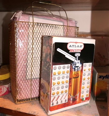 Pantry Shelf Lot including American Pacific Duvet Cover, Marcato - Atlas Biscuits Press, Zyliss Juicer, Cookie Presses, Copper Pot, and Crab Hammer