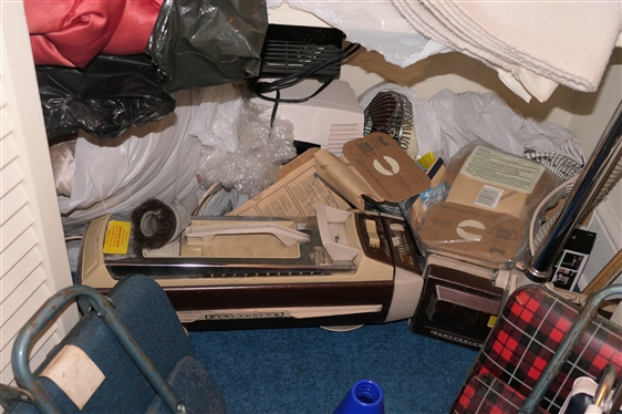 Contents of Bottom of Linen Closet - Electrolux Vacuum Cleaner, Fans, Heater, Humidifier, Vintage Stadium Seats