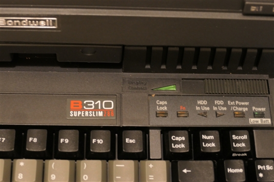 Bondwell B310 Superslim Laptop Computer - with Instruction Manual, Charger, Battery , Manual, and Instructions for Quicken and MS - DOS 5 