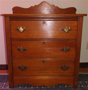 Turn of The Century Oak 3 Drawer Chest with Scalloped Backsplash - 3 Dovetailed Drawers with Brass Hardware and Key Hole - Chest Measures 32" Tall 33" by 17 1/2" 