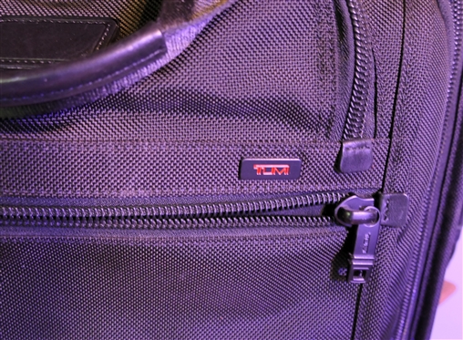 TUMI Rolling Briefcase with Many Zipper Pockets - Retractable Handle - Measures 14 tall 16 by 10 