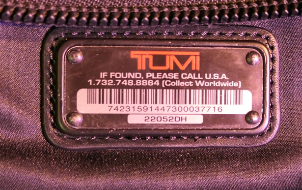 TUMI Rolling Briefcase with Many Zipper Pockets - Retractable Handle - Measures 14 tall 16 by 10 