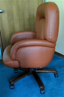 Burnt Orange Bonded Leather Swivel Desk Chair - Oversized Design - Brown Wood Base - Adjustable - Chair Measures 36 Tall 26 Across, 21 Deep