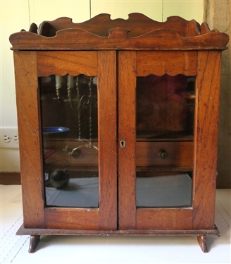 Miniature Cupboard Fitted To Hold Tobacco & Pipes - 2 Drawers Inside - Pipe Holders Line Both Sides - Scalloped Gallery Top and Backsplash and Tops of Doors - Overall Measures 20" Tall 16 1/2" by...