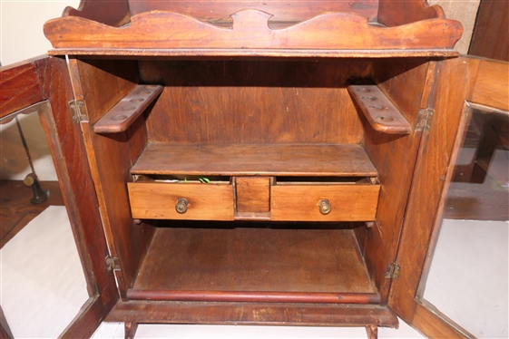 Miniature Cupboard Fitted To Hold Tobacco & Pipes - 2 Drawers Inside - Pipe Holders Line Both Sides - Scalloped Gallery Top and Backsplash and Tops of Doors - Overall Measures 20 Tall 16 1/2 by...