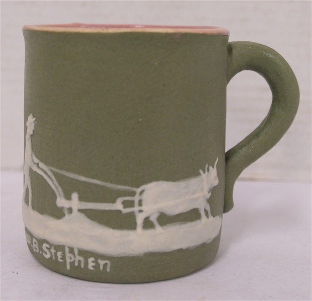 1949 Pisgah Forest Cameo Pottery Mug - Signed W.B. Stephen - Green Glazed Body with Cameo Plowing Farmer - W.B. Stephen - Bottom Dated 1949 with Stephen - Also "Preston" - Mug is 3 1/2" Tall 