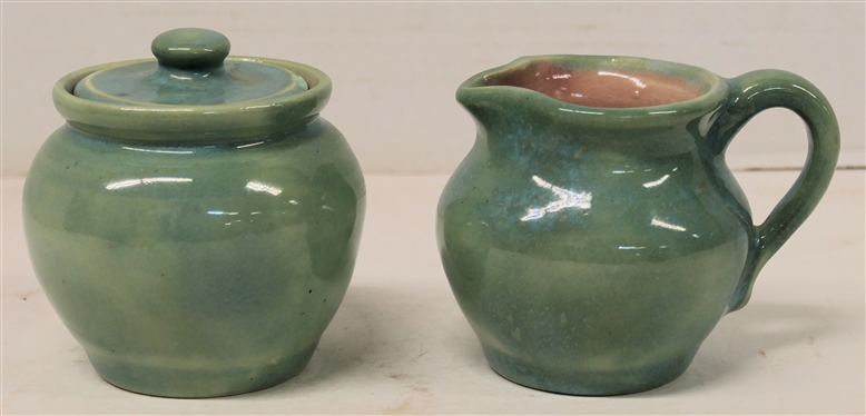 1938 Pisgah Forest Cream and Sugar Set - Light Turquoise / Green Exterior Glaze with Pink Interior - Cream Measures 3 1/4 Tall Sugar is 3 1/2 with Lid - Both Stamped Pisgah Forest 38 