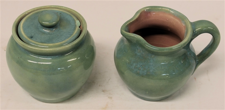 1938 Pisgah Forest Cream and Sugar Set - Light Turquoise / Green Exterior Glaze with Pink Interior - Cream Measures 3 1/4 Tall Sugar is 3 1/2 with Lid - Both Stamped Pisgah Forest 38 