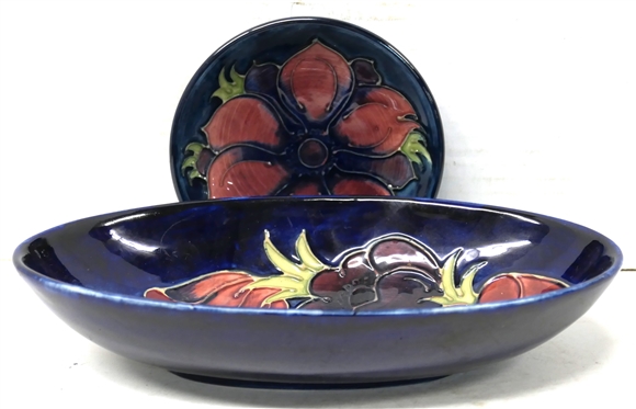 2 Pieces of Moorcroft Pottery - Both Cobalt Glazed with Dark Red Flowers - Smallest Round Dish is 4 1/4 Across Larger Oval Bowl is 2 tall 9 by 5 1/4 