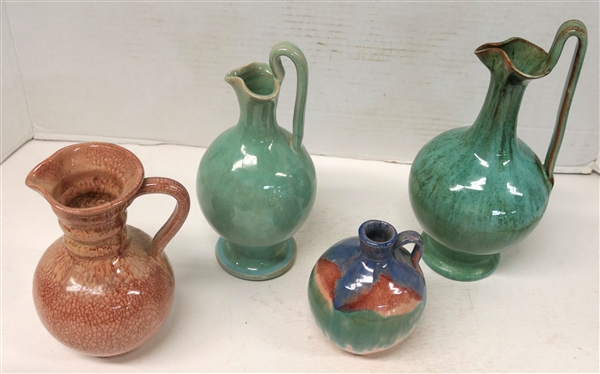 4 Pieces of Seagrove North Carolina Art Pottery - All Unsigned - 9 Rebecca Pitcher with Variegated Green Glaze, 8 Rebecca Pitcher with Lighter Green Glaze, Red Crackle Glazed 6 1/2 Pitcher, and...