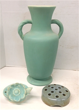 3 Pieces of Pottery - 12 Coors Pottery Matte Green Vase with Twisted Handles, Matte Blue Flower Frog with Flower, and Weller Flower Frog with Speckled Glaze - Weller Frog is 1 1/2 tall 4 Across