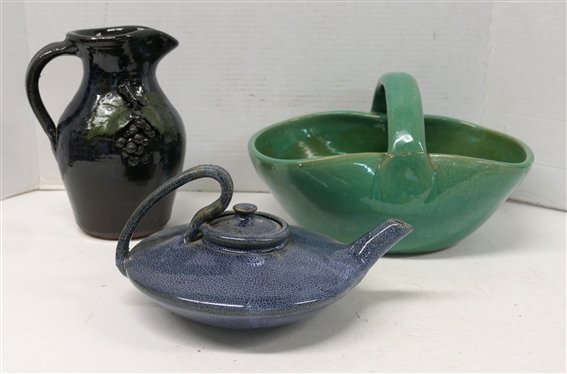3 Pieces of Art Pottery -9 Pitcher with Applied Grapes by Bobby Ferguson - Gillsville, GA, Teagues Pottery Tea Pot - Broken Handle, and Large Green Glazed Basket with Broken Handle 